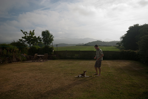 Richard and Skitters play in the garden